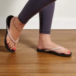 OluKai Ho‘ōpio - Petal Pink Metallic / Black -OluKai Sandal Store 20294 NK40 102 W Ho Opio PepmBlk Web Opt